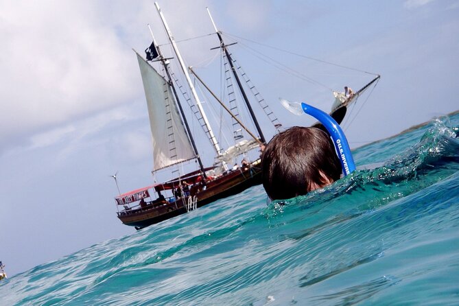 Set Sail in Aruba: Jolly Pirate Cruise with Snorkel Adventure - The rope swing is more than a small extra