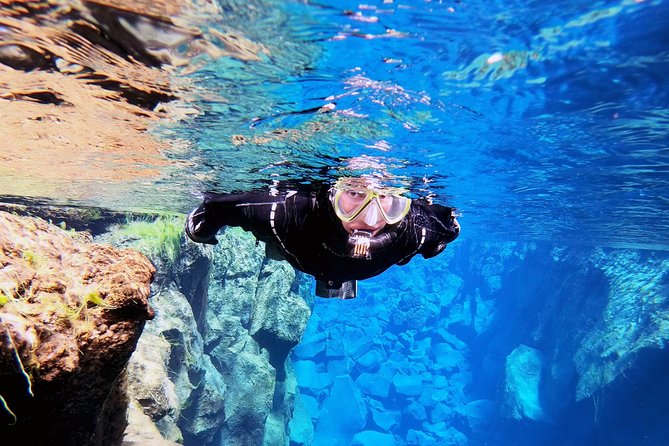 Silfra Drysuit Snorkeling with Free Photos - Meet on Location - Getting into the drysuit