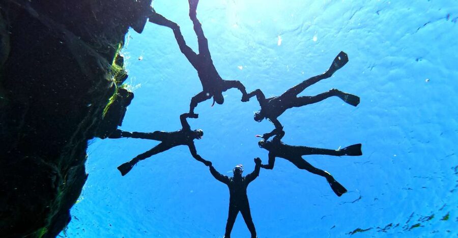 Silfra: Half-Day Snorkeling Day Trip with Underwater Photos - Getting into the drysuit without losing your patience