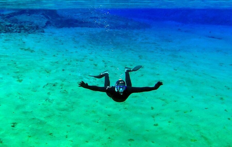 Silfra: Half-Day Snorkeling Day Trip with Underwater Photos - Floating between the American and Eurasian plates
