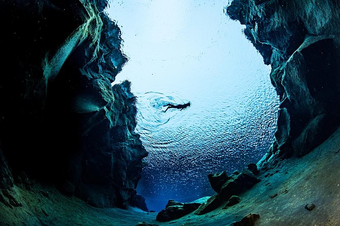 A swimmer above the Silfra fissure in Iceland