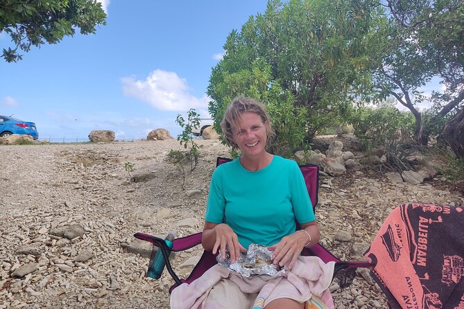Snorkeling and Grilling Fresh Fish at Donkey Beach - Cleaning and grilling the catch