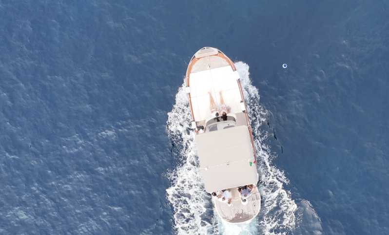 Sorrento: Capri and Blue Grotto Yacht Tour with Snorkeling - Cruising around Capri’s famous coast