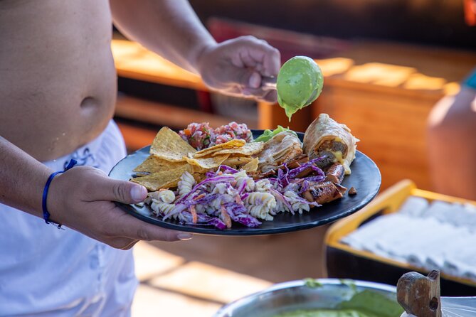 Treasure Hunt Snorkeling Lunch Cruise from Cabo San Lucas - Music and games keep the deck active