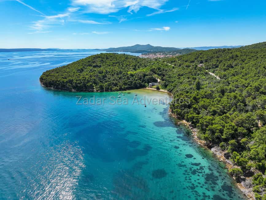 Zadar: Island Hopping Tour Swim and Snorkel with Aperol - Stop one: a quiet bay for swimming and snorkeling